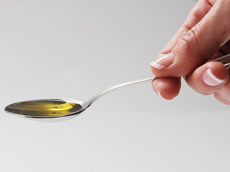 Welltone drops in a spoon